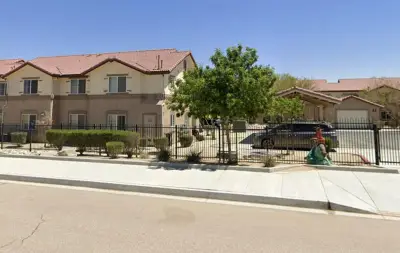 Mom, holding infant, monitors 12-year-old she let move the car. Car hits her, she drops the baby