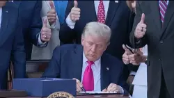 President Trump signs his tax and spending cut bill at the White House July 4 picnic