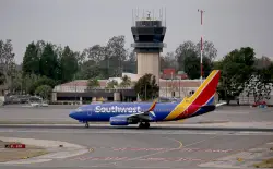 Car drives onto active taxiway at O.C. airport; driver is hospitalized, official says